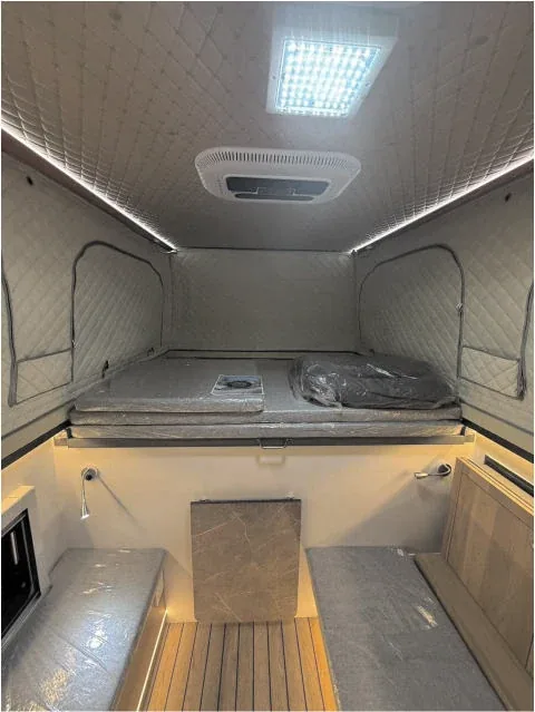 Camper sleeping area under the raised roof