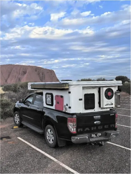 Rear view of the TUYU aluminium hard-top camper with external storage and jerry can